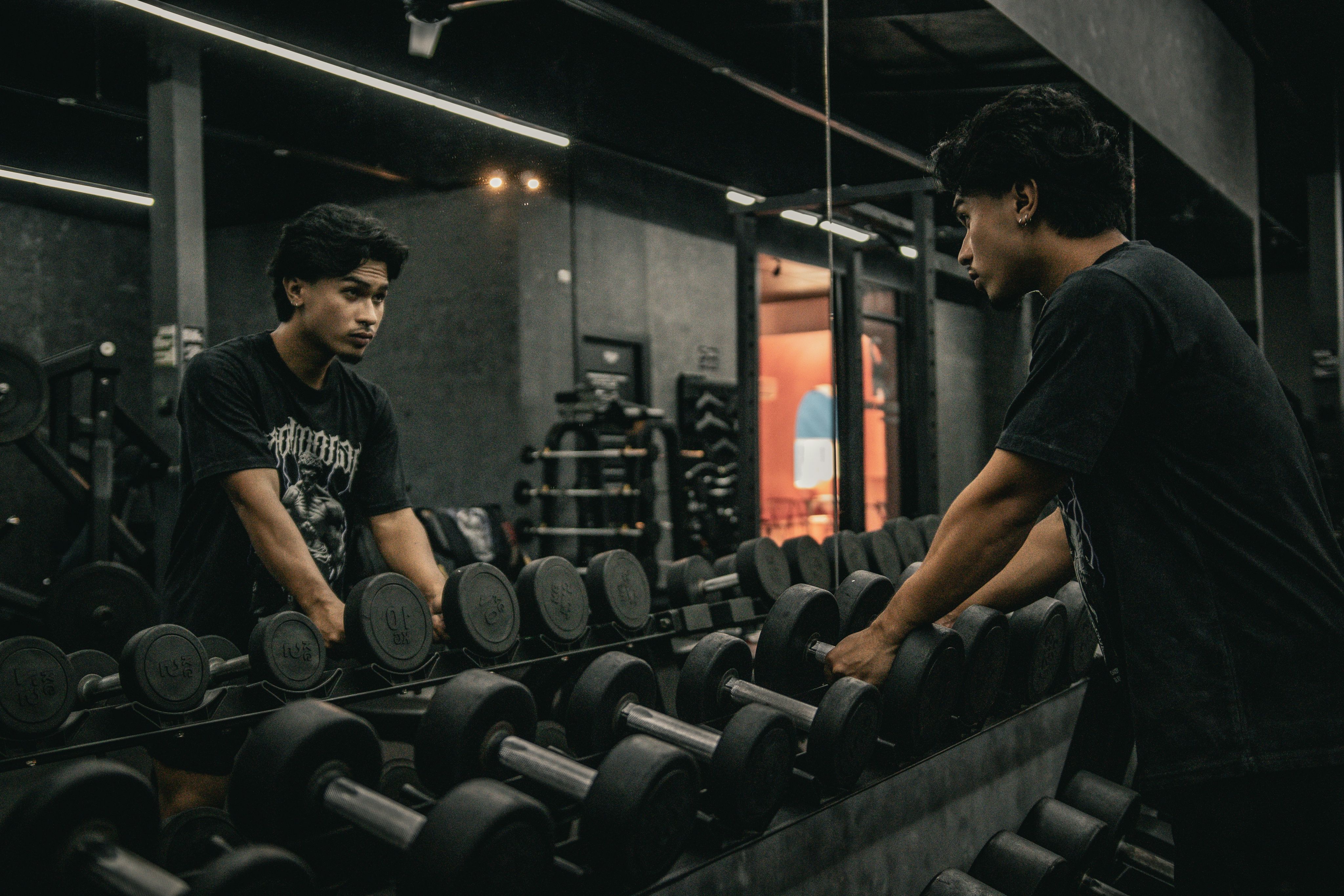 A couple of men working out in a gym